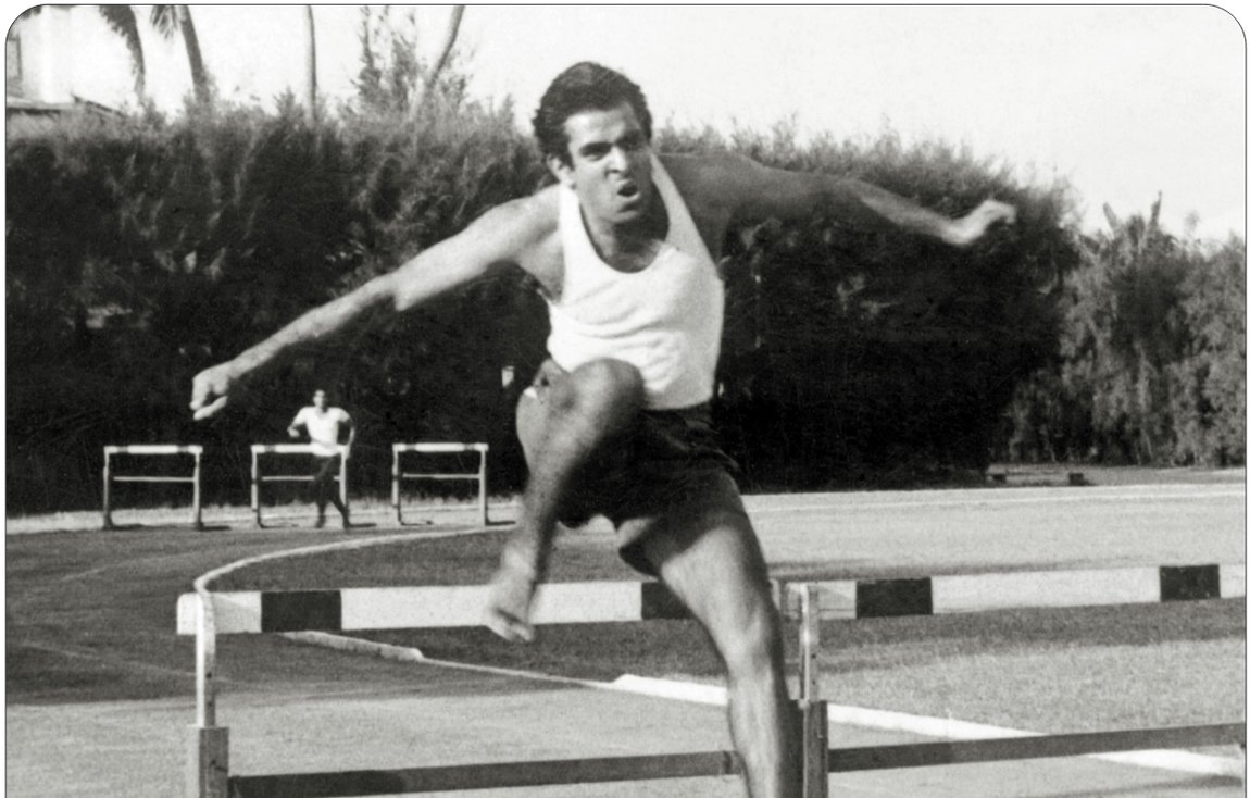 Promesse clearing a hurdle in a race
