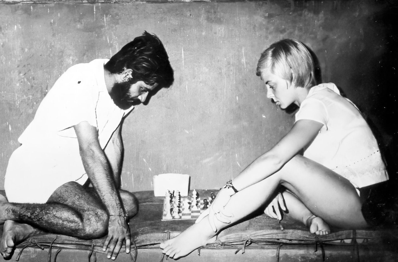 Engrossed in a game of chess with Ilona Ecgold (a gymnast from Germany)