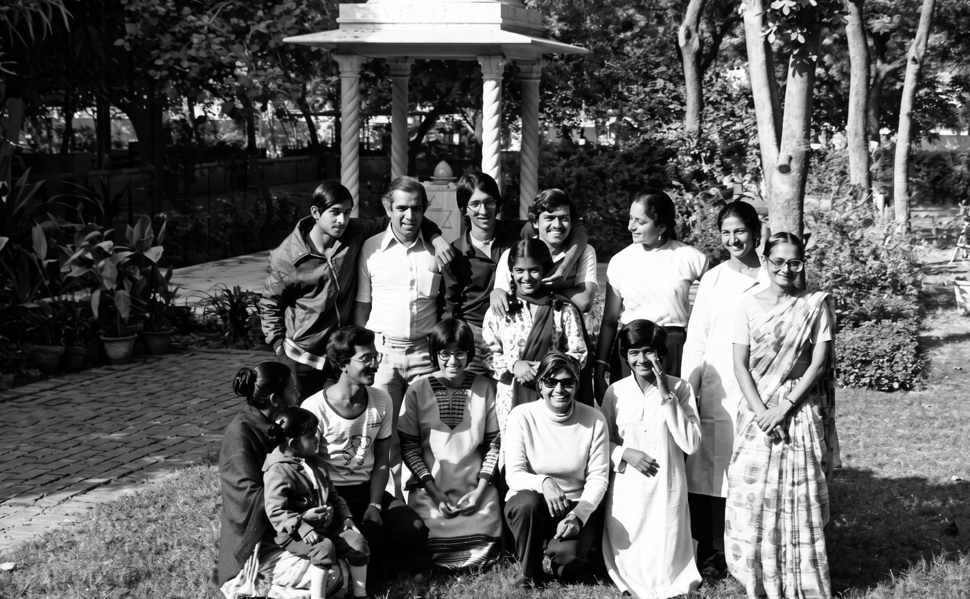 Promesse (standing 2nd from left) with his students