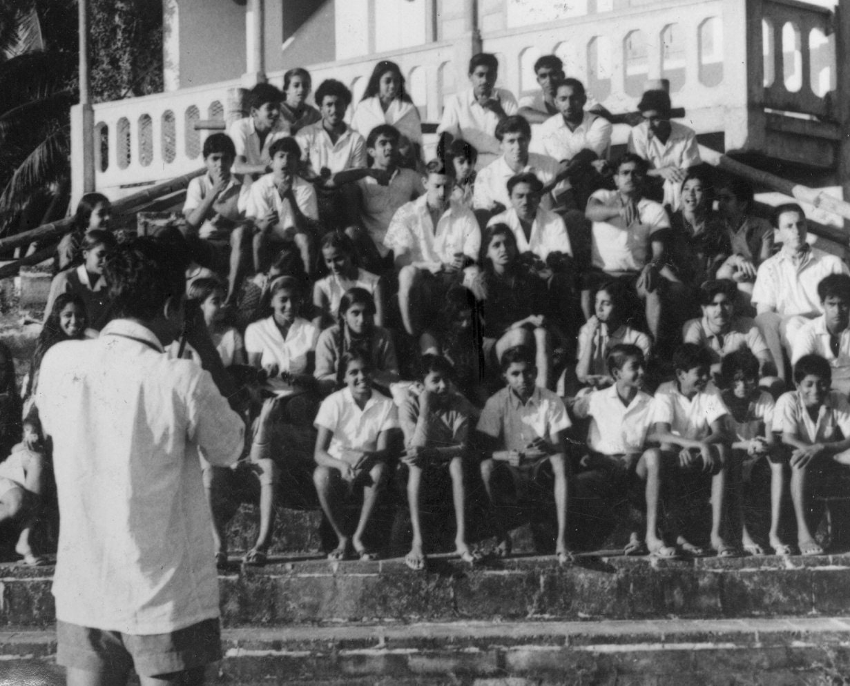 Rows of Ashram students and sadhaks seated on the Ashram steps, being photographed