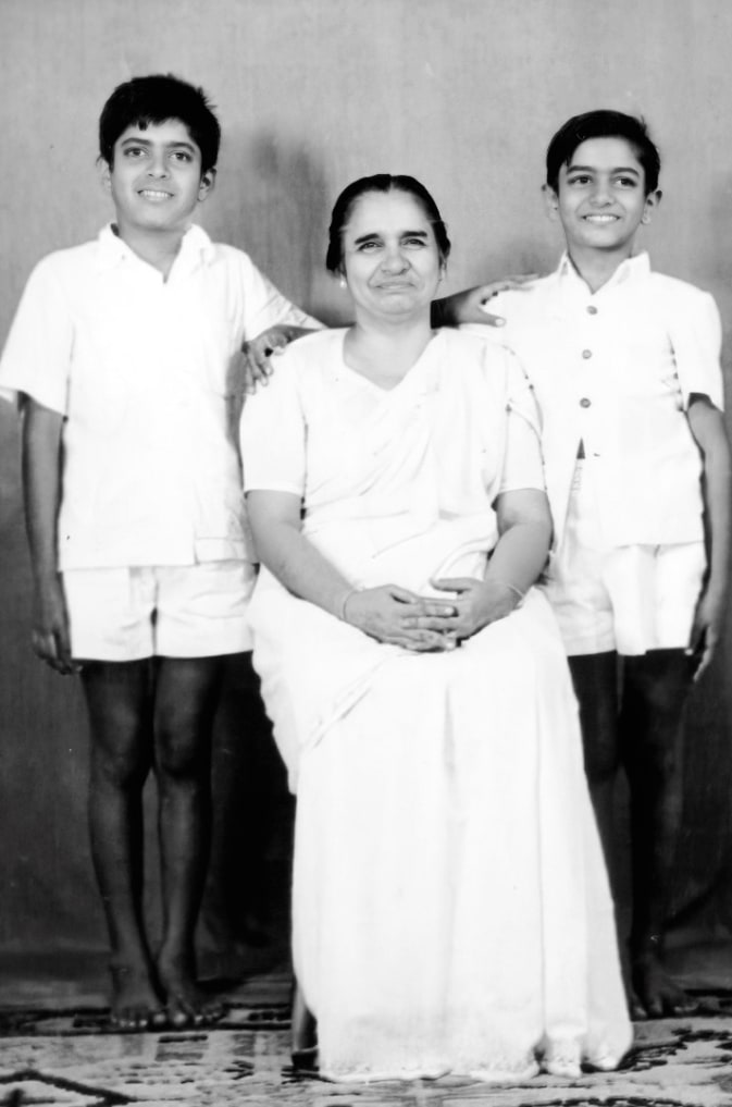 Dayawati Jauhar seated between her two young sons