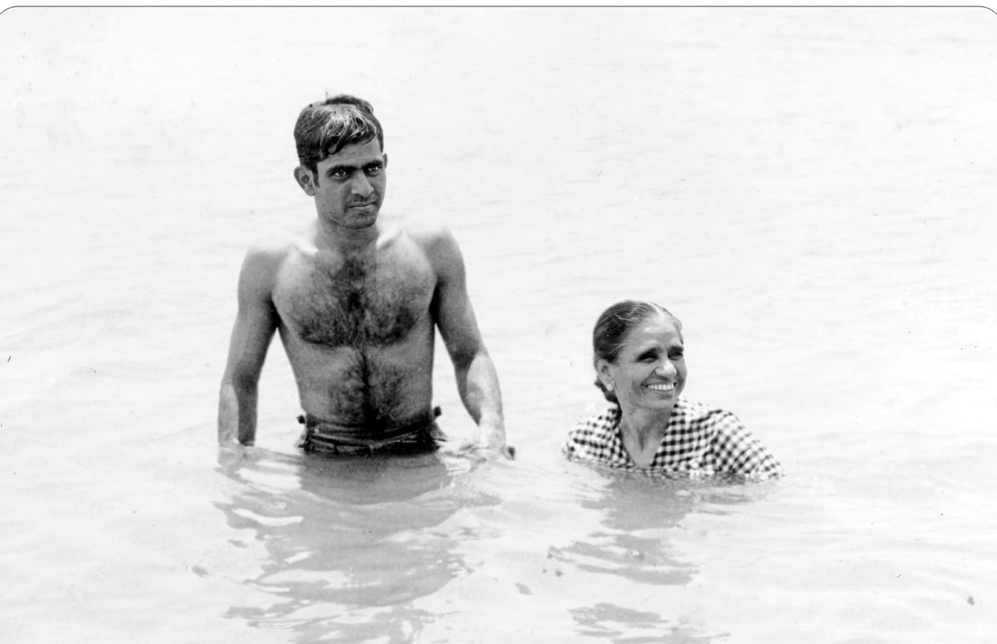 Promesse and his mother together in the water