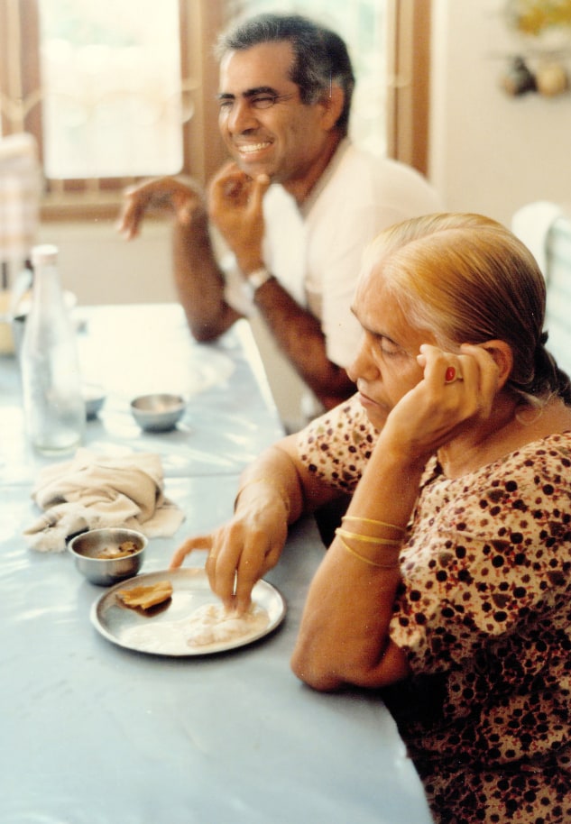 Promesse and his mother at the dining table