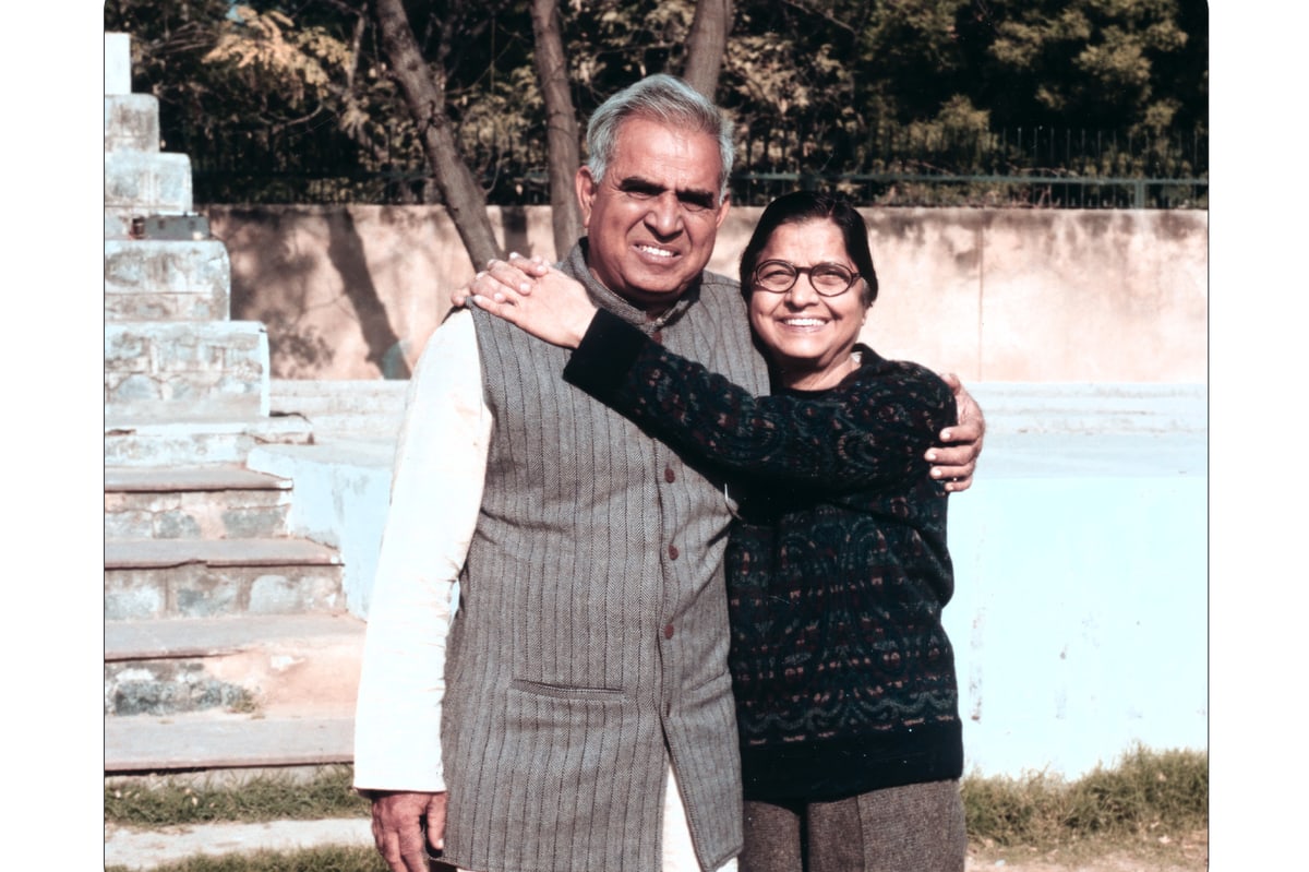 Tara Jauhar with her younger brother Promesse, arm in arm in a sunlit garden